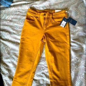 NWT mustard color skinny jeans